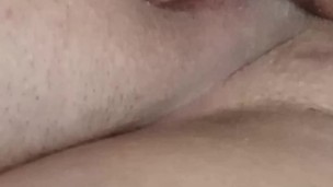 Playing with a glass dildo